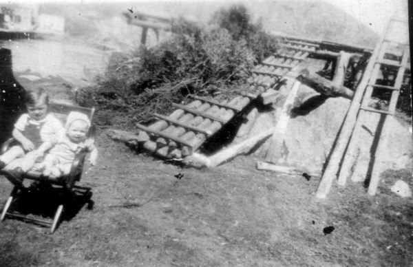656: Victor Lambe and Michael Norman by a fishing stage. (circa 1948) [courtesy of Julia (Carroll) Best]  - Victor son of Michael Lambe &amp;amp; Julia Carroll; Michael son of Patrick Norman &amp;amp; Anastasia Lambe